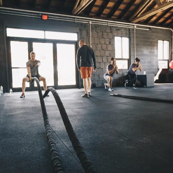 Man training with ropes at OCFIT